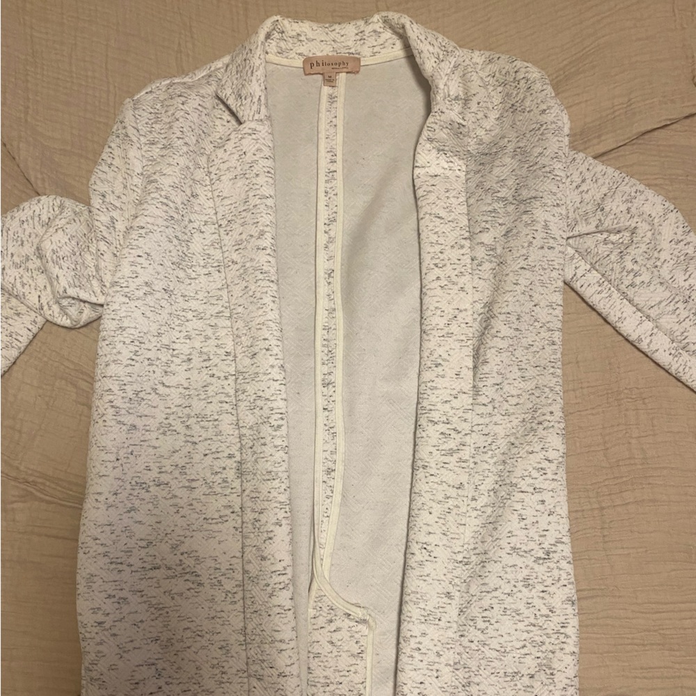 White drapey cardigan sweater with heathered grey/white print